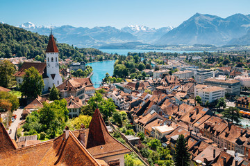 Thun cityscape with Alps mountain and lake in Switzerland - obrazy, fototapety, plakaty