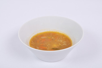 Potato soup with flakes on a white