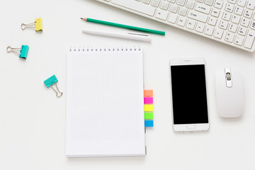 white Desk, smart phone, lying on the table, white background with copy space, for advertisement, top view	
