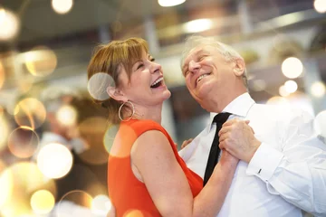 Foto op Aluminium Romantic senior couple dancing together at dance hall © goodluz