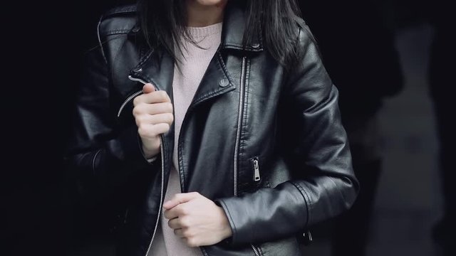 Stylish woman in black leather jacket