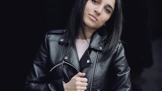 Stylish woman in black leather jacket