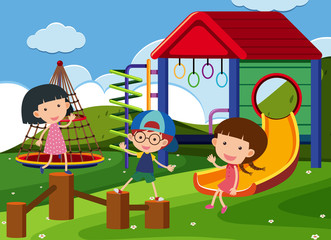 Obraz na płótnie Canvas Three kids playing in the playground