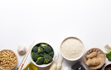 Chinese food raw ingredients, vegetables and nuts on the white background with copy space