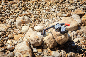 mask and snorkel lies on the beach