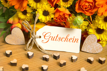Blumen und Karte: Gutschein