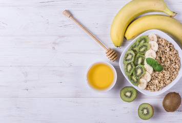 Fototapeta na wymiar Healthy breakfast oatmeal with fruits