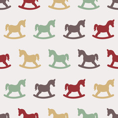 Seamless childish pattern with rocking horse.