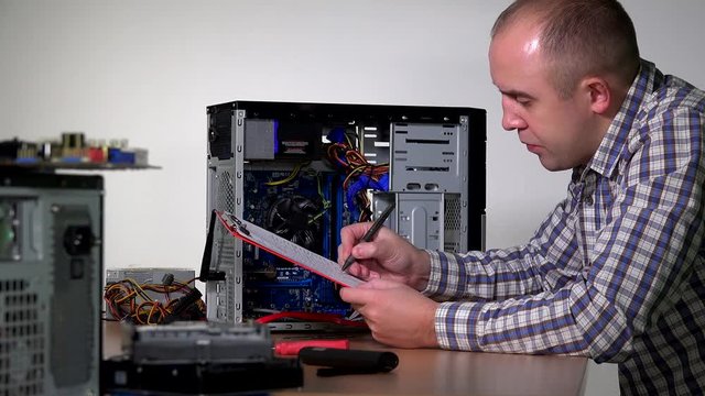 Professional computer service specialist man install ram memory