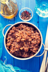 rice with rabbit on dish on wooden background