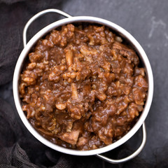 rice with rabbit on dish on black ceramic background