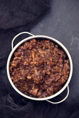 rice with rabbit on dish on black ceramic background