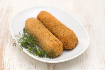 meat croquetes on white dish