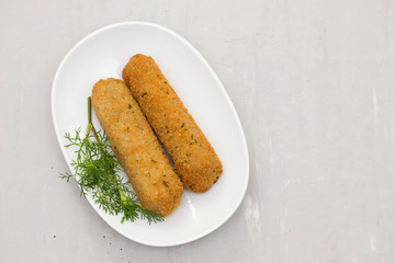 meat croquetes on white dish