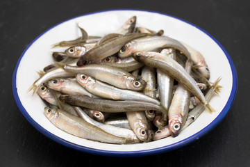 small fish in white plate