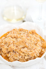 rice wtih cod fish and tomato on beautiful white bowl