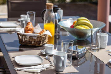 A healthy morning breakfast in yard. In summer.