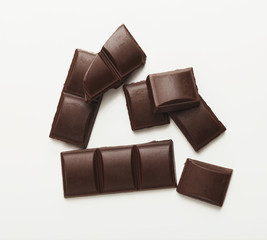 Bar of dark chocolate isolated on white