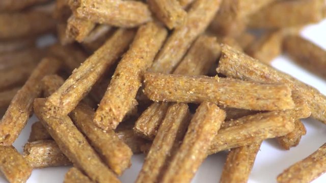 Portion of rotating Bread Chips as seamless loopable 4K UHD footage