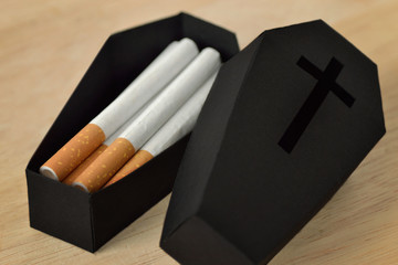Cigarettes in a black coffin - Stop smoking concept