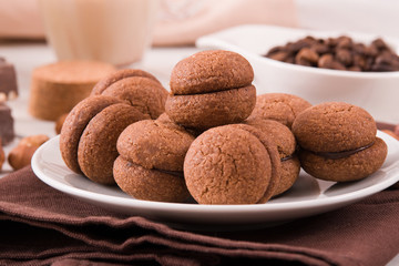 Hazelnut shortbread sandwiches filled with chocolate cream 