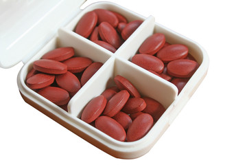 Vitamin and medication tablets in white box,nourishing blood after donating blood isolated on white background