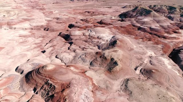 Aerial view flying over Mars desert in Utah on sunny day.