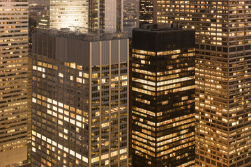 View of modern skyscrapers in city at night