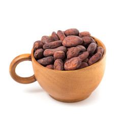 Cocoa fruit, raw cacao beans in cup isolated on a white background
