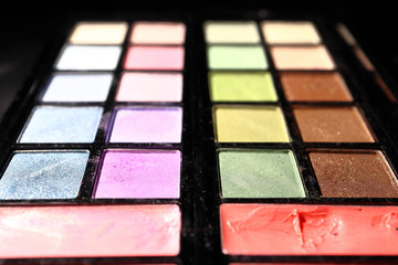 Eye shadow on a black background. Close up