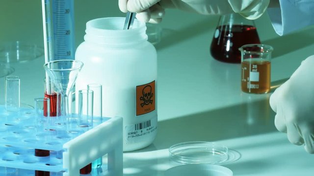 Researcher mixes toxic substances in a laboratory