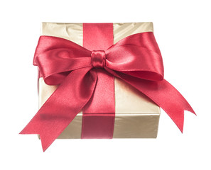 Gift wrapped in glittery paper with red ribbon isolated on white