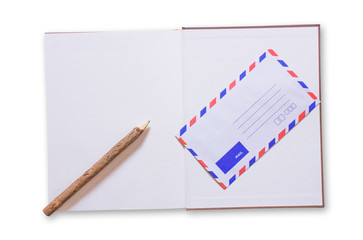 Open notebook and mail on white background. Top view. Copy space.
