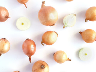 Onions isolated on white background, pattern, top view, creative flat layout.