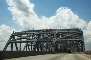 Driving across the Huey P. Long Bridge over the Missssippi River in Louisiana, USA; Concept for road trip in the USA and Louisiana