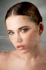 Naklejka premium Portrait of young beautiful girl in Studio, with professional makeup. Beauty shooting.