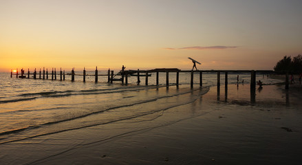 wooden jetty in the sunset