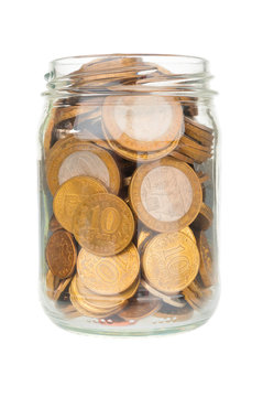 Glass jar with ruble coins isolated on white background