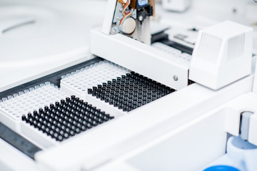 Close-up view on the sample tubes of the medical analyzer in the laboratory