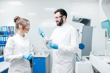 Laboratory assistants workign with test tubes