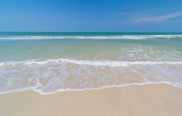 Fototapeta na wymiar White sandy beach, blue sky, clear sea, summer