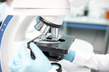 Close-up view on the microscope with test sample at the laboratory