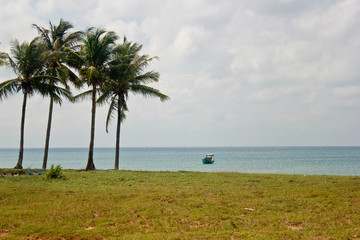 Single fishing boat in a tropical island