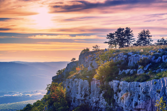 Magic warm sunset and mountain stone cliff in Croatia