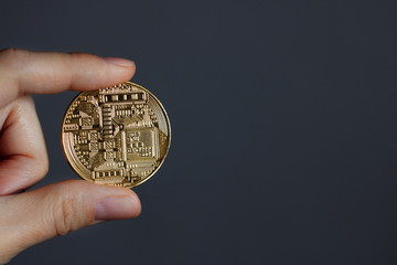 Bitcoin in the person's hand. Electronic money, digital currency