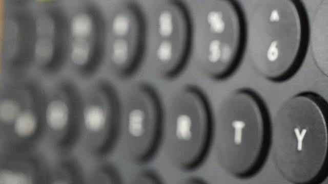 Black computer keyboard detail qwerty view closeup.