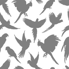 Light grey parrots silhouette seamless pattern
