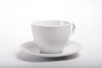 Empty ceramic coffee cup with saucer on white background.

