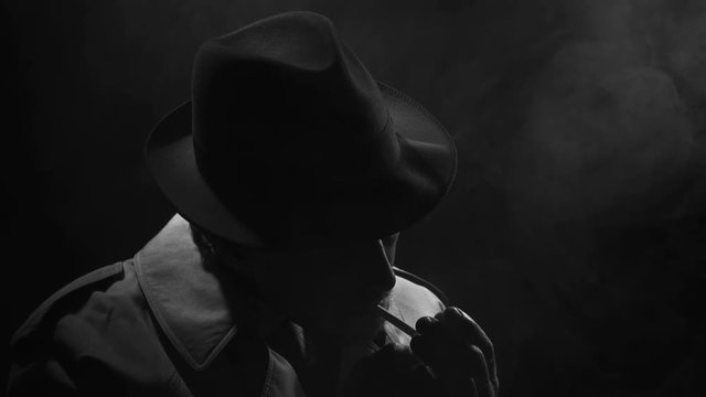 Noir spy film character smoking a cigarette
