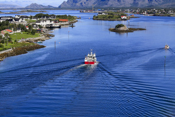 Fototapeta premium Fishingboat passing - Tourist's lookout point from Brønnøysund bridge Northern Norway